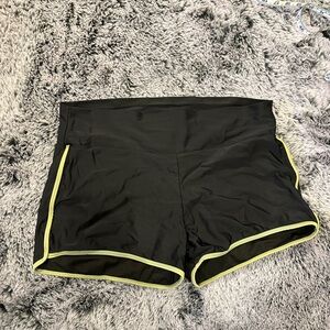 Black Women's swim shorts with green trim